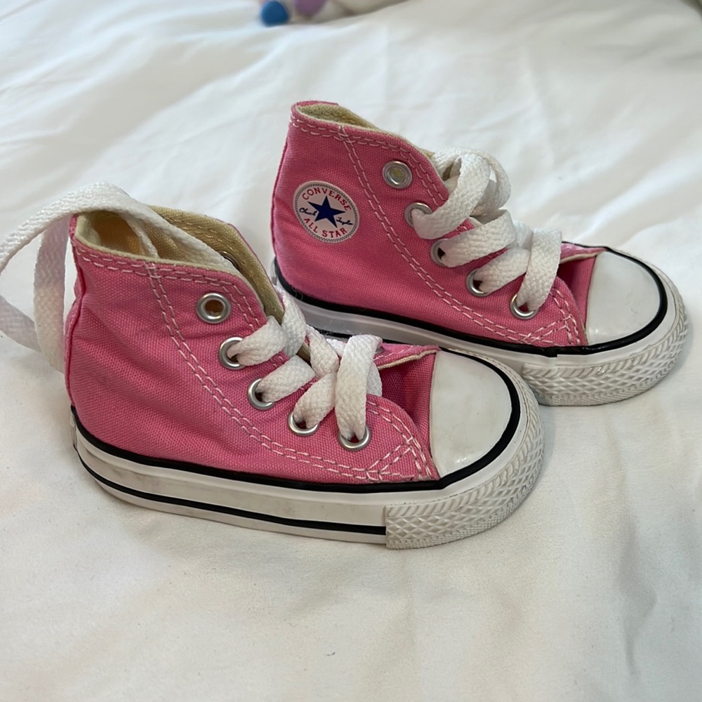 Pink Chuck Taylor converse high tops